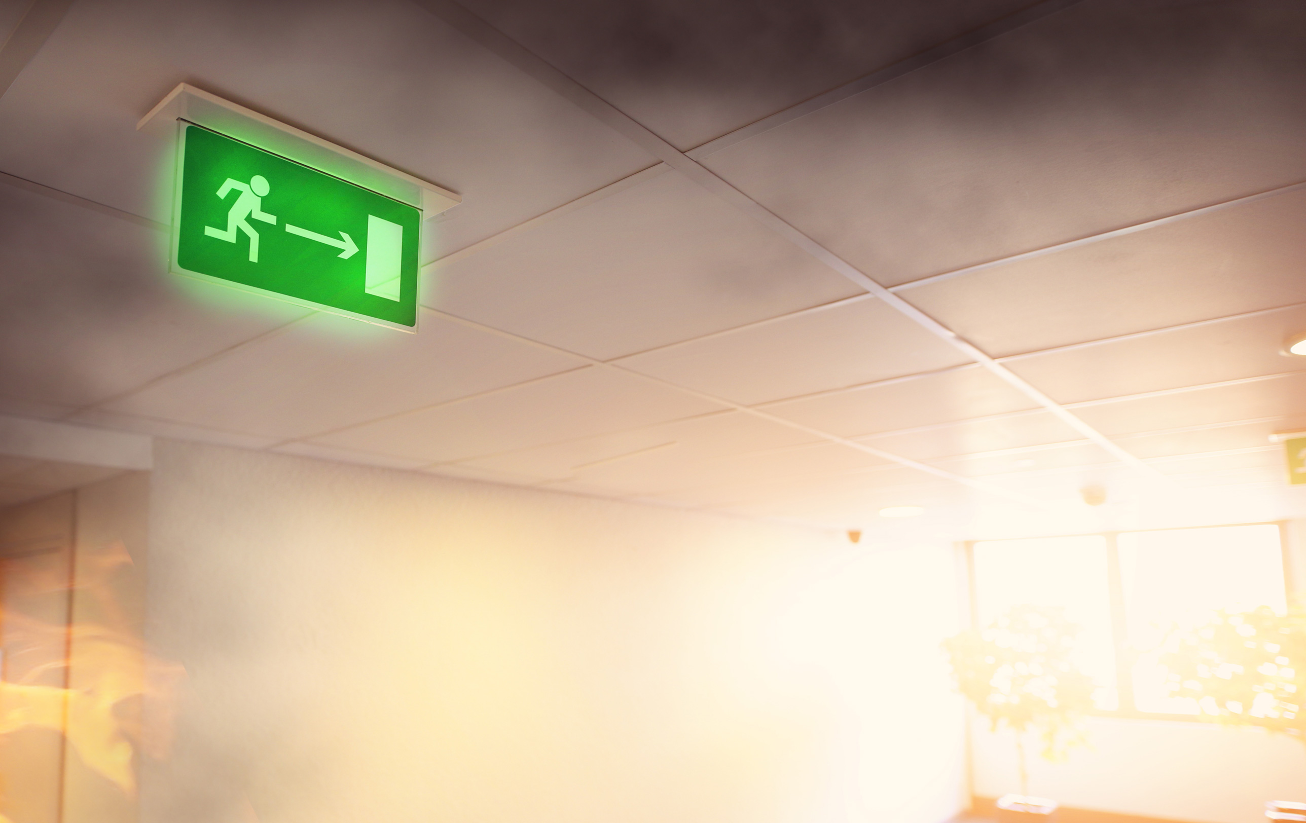 Symboldild beleuchtetes Schild für Notausgang